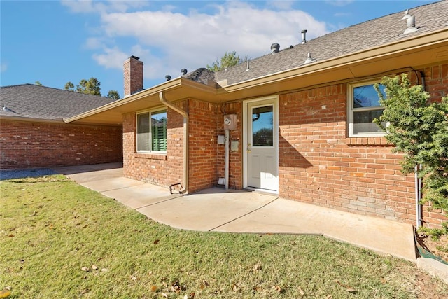 12600 Green Valley Dr, Oklahoma City, OK 73120 - rear view of property with brick siding, a yard, and a patio