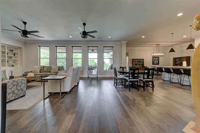 living area featuring recessed lighting, a ceiling fan, dark wood-style floors, and ornamental molding