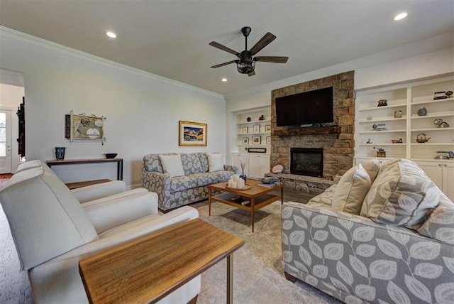 living room featuring built in features, recessed lighting, a ceiling fan, a fireplace, and ornamental molding