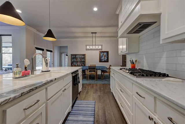 kitchen with stainless steel gas cooktop, a sink, white cabinetry, dishwashing machine, and under cabinet range hood