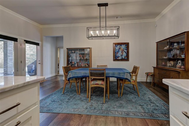 dining area featuring baseboards, ornamental molding, visible vents, and dark wood-style floors