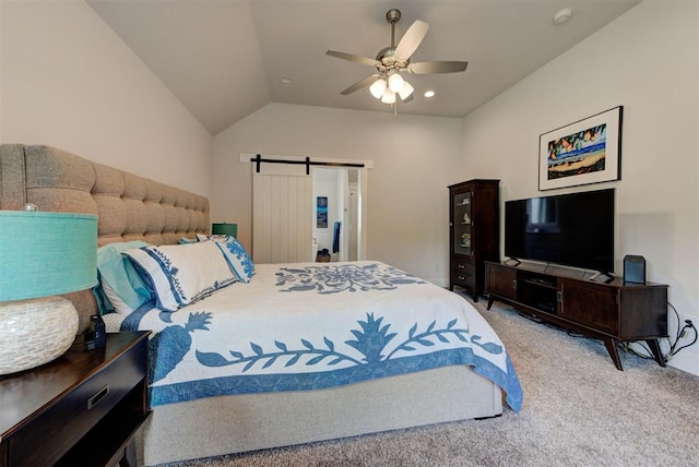 bedroom featuring lofted ceiling, carpet, ceiling fan, and a barn door