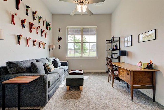 interior space featuring visible vents, baseboards, and ceiling fan