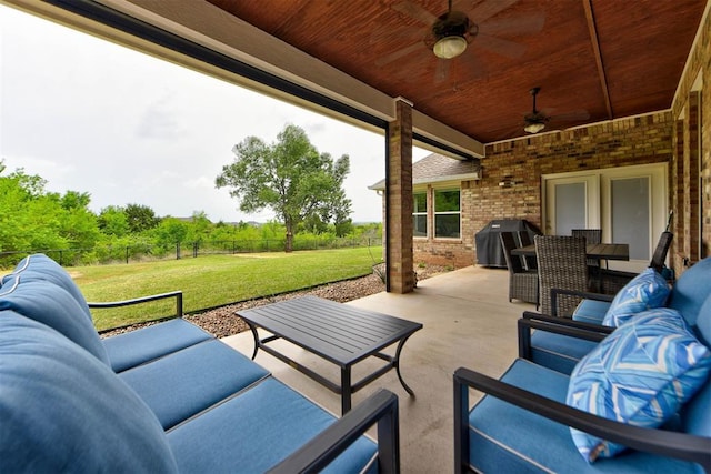 view of patio / terrace with a fenced backyard, an outdoor hangout area, ceiling fan, and area for grilling