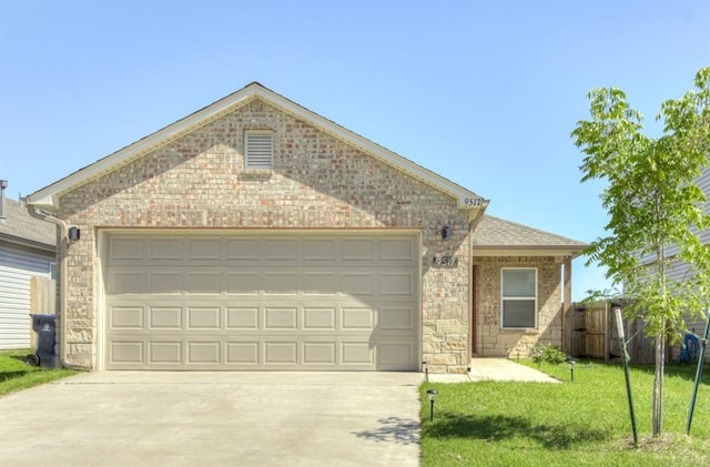 ranch-style home with concrete driveway, a garage, and brick siding