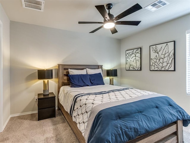 carpeted bedroom featuring baseboards and a ceiling fan