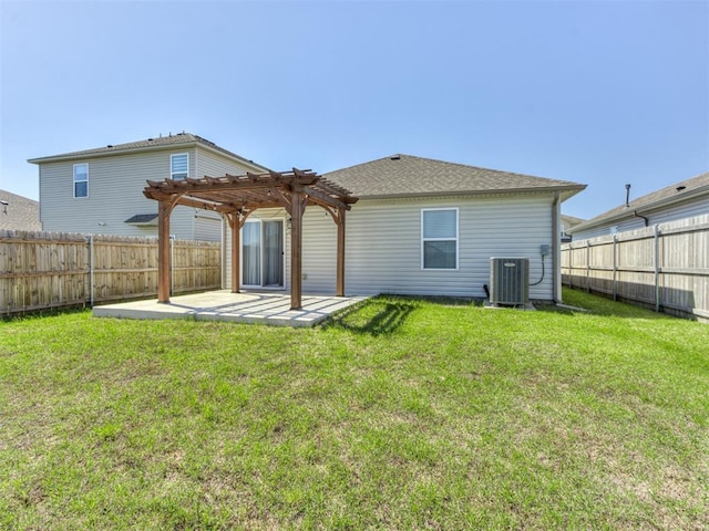 rear view of property with a pergola, a patio area, and central AC
