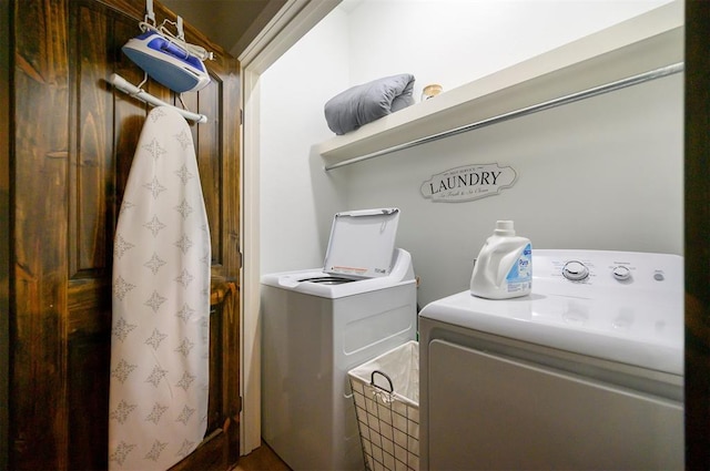 washroom featuring washer and dryer and laundry area