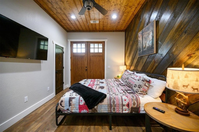bedroom featuring wood finished floors, visible vents, a ceiling fan, wooden ceiling, and baseboards