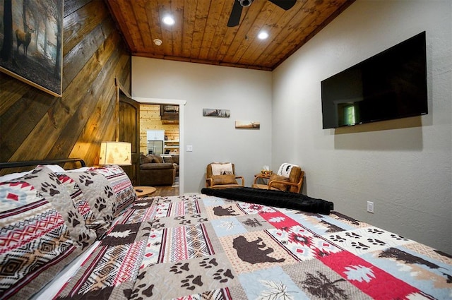 bedroom featuring wood finished floors, ceiling fan, wooden ceiling, wood walls, and recessed lighting