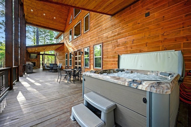 wooden deck featuring outdoor dining area and area for grilling
