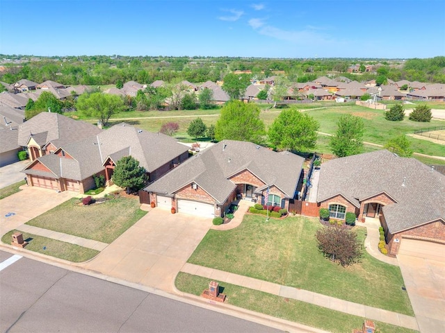 birds eye view of property with a residential view