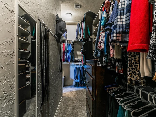 spacious closet with carpet floors and visible vents
