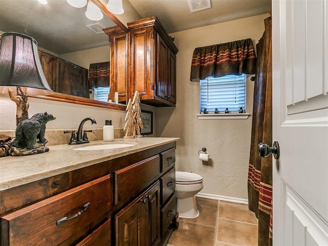 full bath featuring visible vents, tile patterned flooring, baseboards, vanity, and toilet