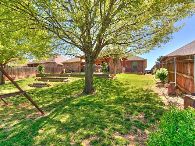 view of yard with a fenced backyard