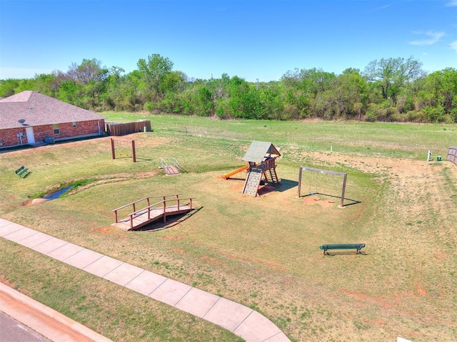 exterior space featuring a lawn and a playground