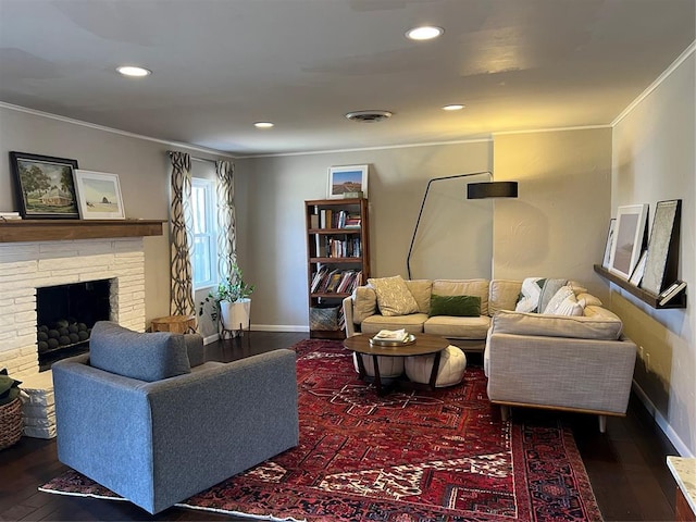 2813 Clermont Pl, Oklahoma City, OK 73116 - living area featuring crown molding, wood-type flooring, baseboards, recessed lighting, and a fireplace with raised hearth