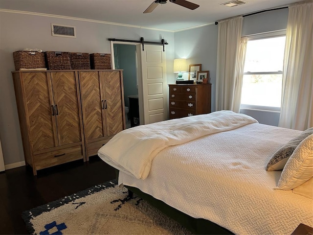 2813 Clermont Pl, Oklahoma City, OK 73116 - bedroom featuring a barn door, wood finished floors, ornamental molding, and ceiling fan