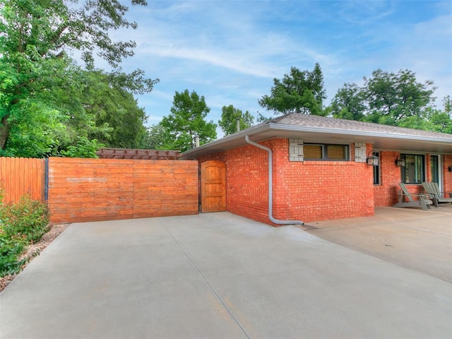 2813 Clermont Pl, Oklahoma City, OK 73116 - view of side of home featuring brick siding
