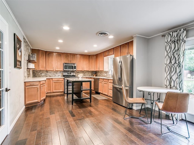 2813 Clermont Pl, Oklahoma City, OK 73116 - kitchen featuring appliances with stainless steel finishes, dark wood-style flooring, light countertops, backsplash, and recessed lighting