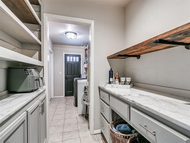 2813 Clermont Pl, Oklahoma City, OK 73116 - washroom featuring light tile patterned floors and washing machine and dryer
