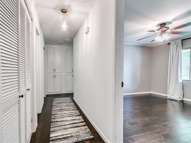 2813 Clermont Pl, Oklahoma City, OK 73116 - corridor featuring dark wood-type flooring and ornamental molding
