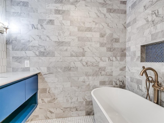2813 Clermont Pl, Oklahoma City, OK 73116 - full bathroom with a freestanding tub, vanity, and tile walls