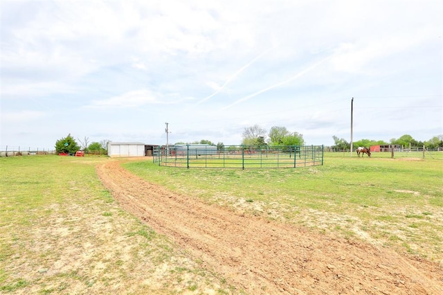19206 Coker Rd, Shawnee, OK 74801 - view of yard with a rural view, an outbuilding, fence, and an exterior structure