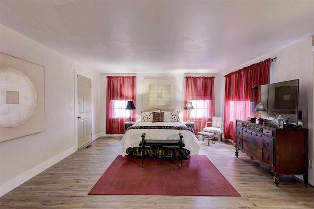 19206 Coker Rd, Shawnee, OK 74801 - bedroom with wood finished floors and baseboards