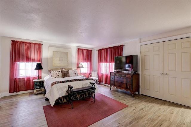 19206 Coker Rd, Shawnee, OK 74801 - bedroom with a closet and wood finished floors