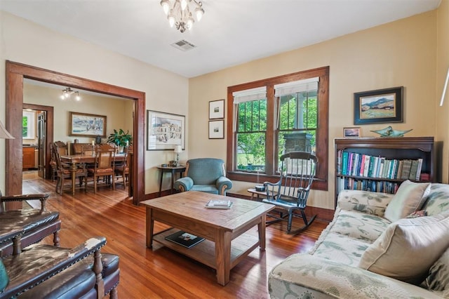 living area featuring healthy amount of natural light and wood finished floors