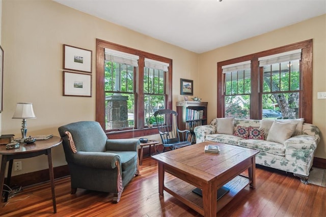 living room with plenty of natural light and hardwood / wood-style flooring