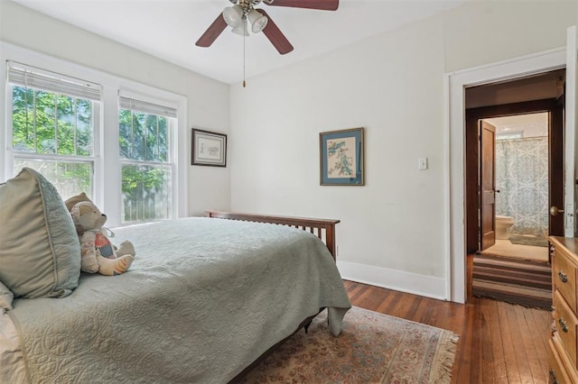 bedroom featuring wood-type flooring, baseboards, and a ceiling fan