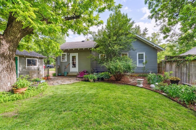 rear view of property featuring entry steps