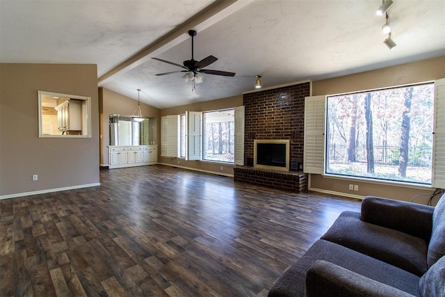 unfurnished living room with baseboards, a ceiling fan, dark wood-style flooring, and lofted ceiling with beams