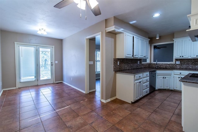kitchen with ceiling fan, decorative backsplash, a sink, and dishwashing machine