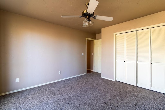 unfurnished bedroom with baseboards, a ceiling fan, carpet, and a closet