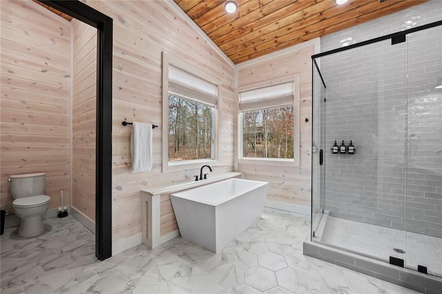bathroom featuring wood walls, marble finish floor, wood ceiling, a freestanding bath, and a shower stall