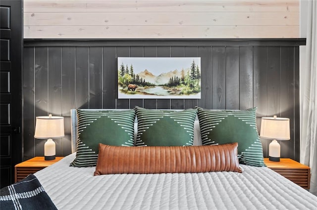 bedroom with wooden walls