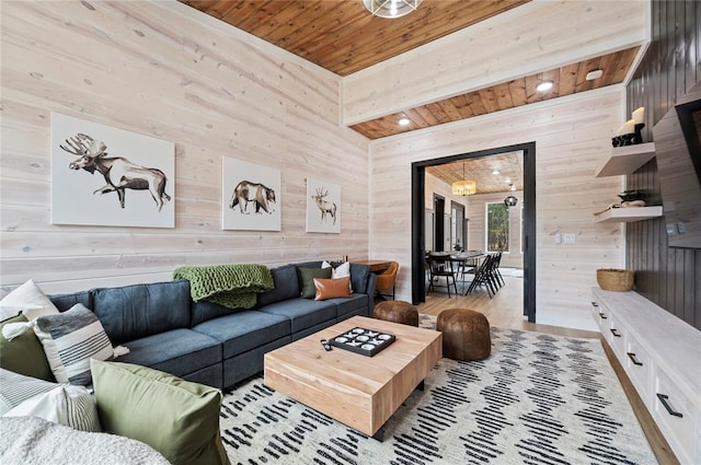 living area featuring wood walls, wooden ceiling, and wood finished floors