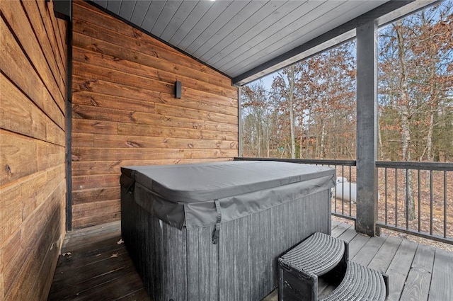 wooden terrace featuring a hot tub