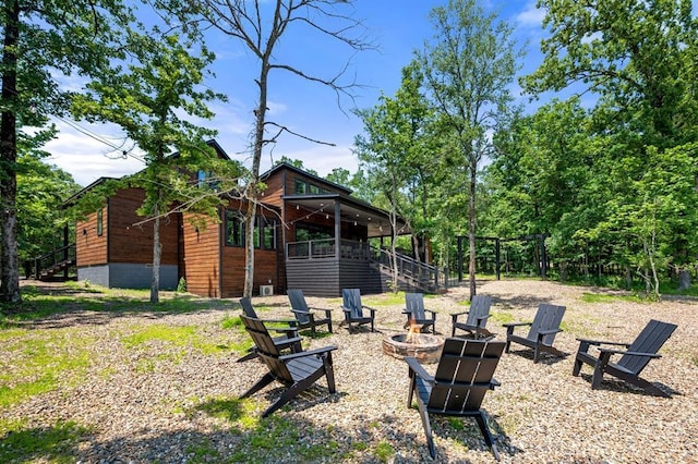 450 Whomping Willow Way, Broken Bow, OK 74728 - view of yard with stairway and a fire pit