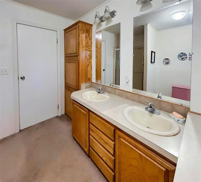 full bath featuring double vanity, an enclosed shower, and a sink