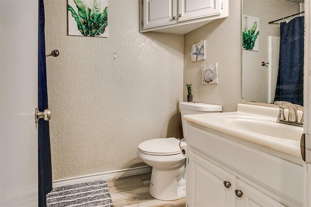 716 SW 149th Pl, Oklahoma City, OK 73170 - bathroom with a textured wall, vanity, and toilet
