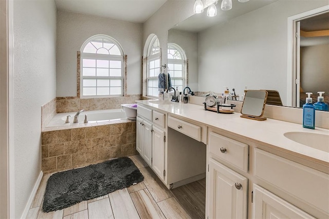716 SW 149th Pl, Oklahoma City, OK 73170 - bathroom featuring a garden tub, a sink, and double vanity