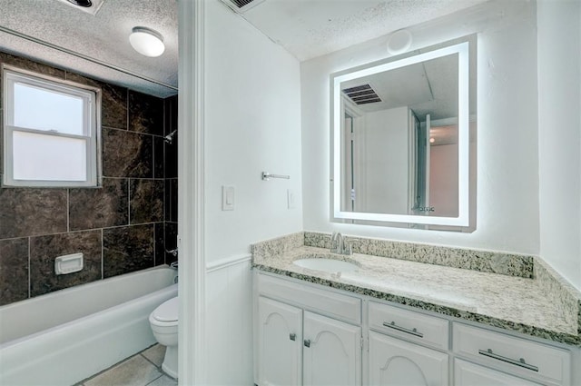 full bath featuring a textured ceiling, vanity, tile patterned floors, toilet, and  shower combination