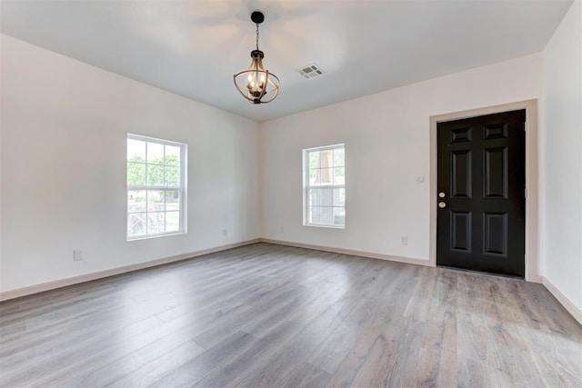 1608 NE 21st St, Oklahoma City, OK 73111 - interior space with a chandelier, light wood-type flooring, visible vents, and baseboards