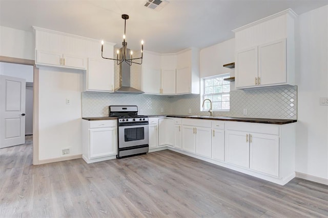 1608 NE 21st St, Oklahoma City, OK 73111 - kitchen featuring open shelves, dark countertops, and stainless steel gas range