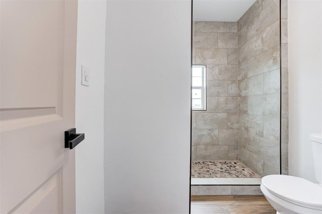 1608 NE 21st St, Oklahoma City, OK 73111 - bathroom featuring walk in shower, wood finished floors, and toilet