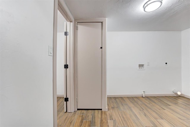 1608 NE 21st St, Oklahoma City, OK 73111 - clothes washing area with hookup for an electric dryer, baseboards, washer hookup, wood finished floors, and laundry area